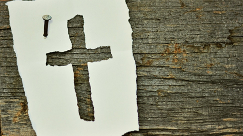 torn out cross nailed to wood.png